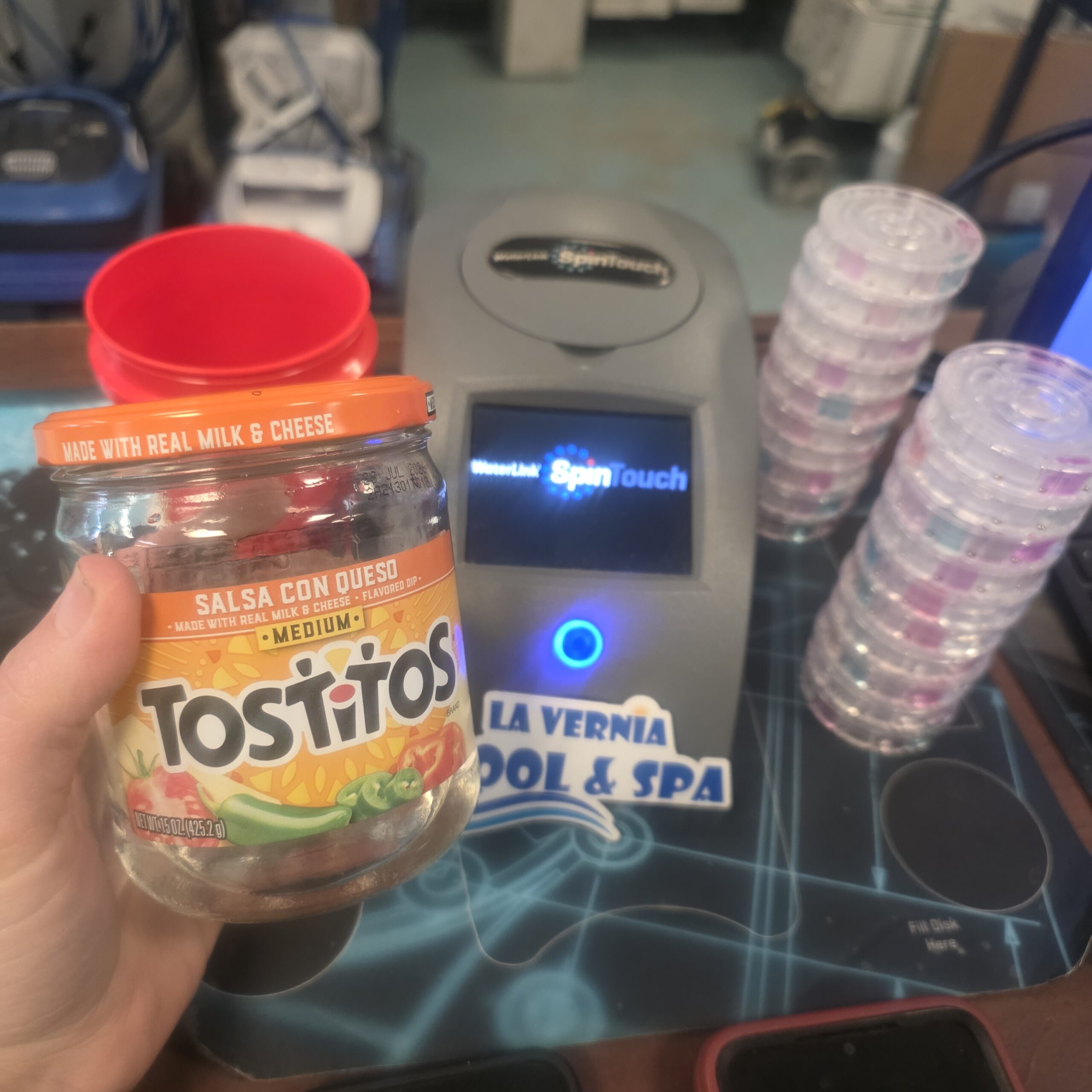 queso jar pool water sample